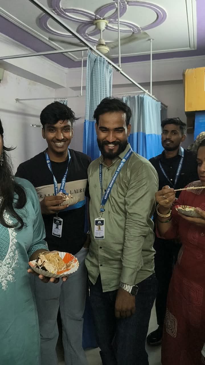 Volunteers sharing a meal together indoors